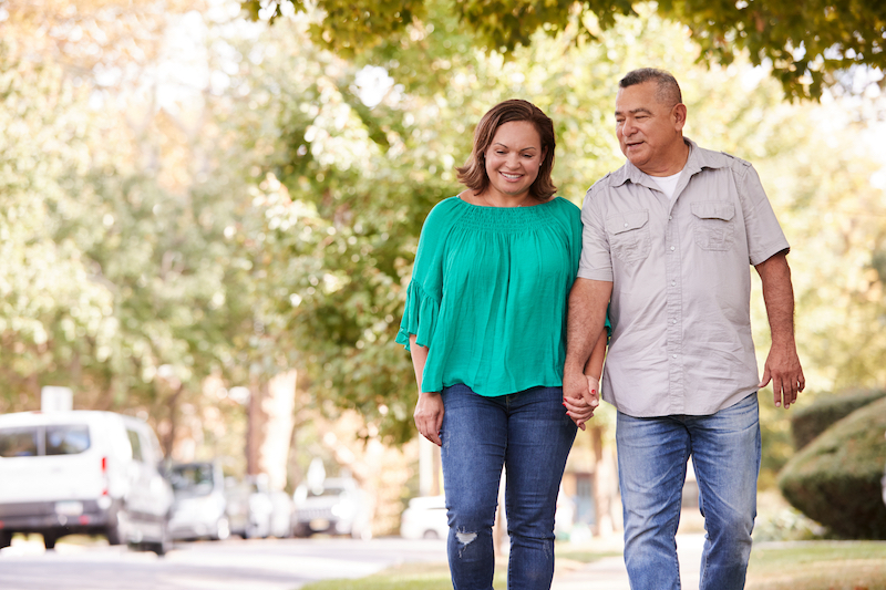 Middle age couple walking in a park