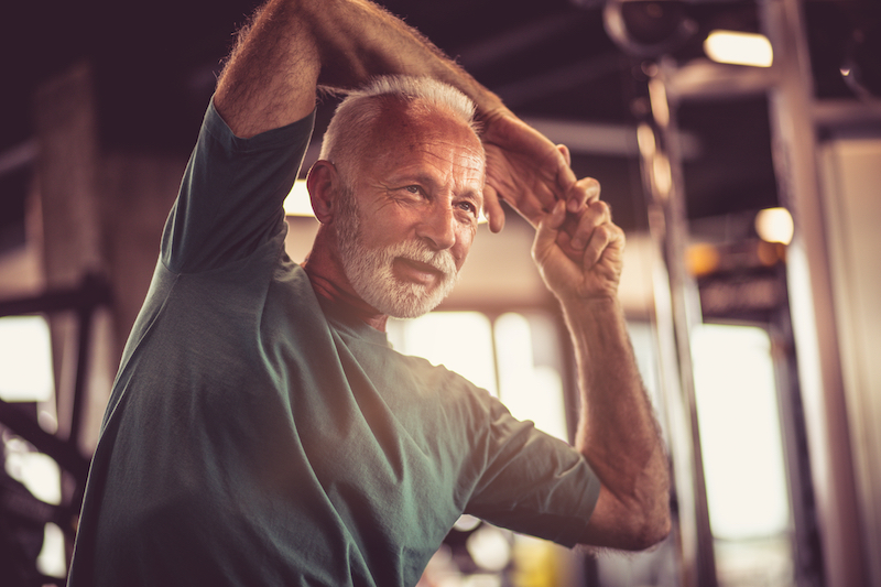 Senior man stretching